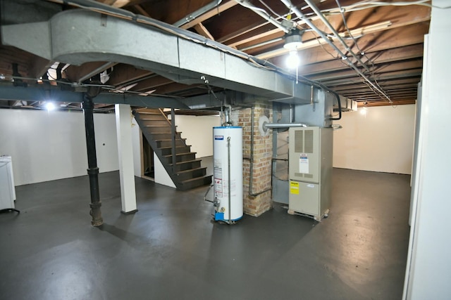 313 N Jackson St, Waukegan, IL 60085 - unfinished basement featuring gas water heater and stairway
