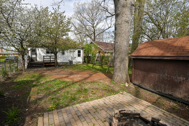 313 N Jackson St, Waukegan, IL 60085 - view of yard featuring a wooden deck and an outdoor structure