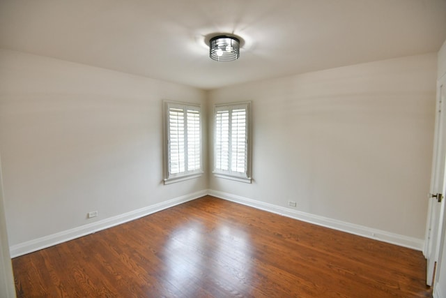 313 N Jackson St, Waukegan, IL 60085 - unfurnished room featuring dark wood finished floors and baseboards