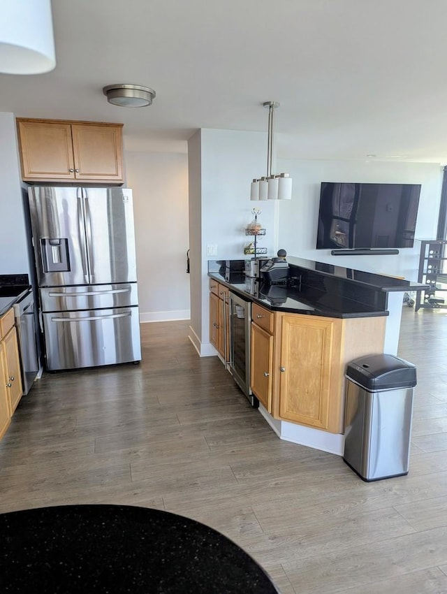 kitchen featuring stainless steel refrigerator with ice dispenser, wine cooler, light wood-type flooring, baseboards, and a peninsula