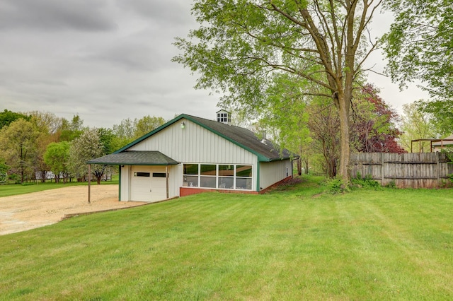 garage with dirt driveway