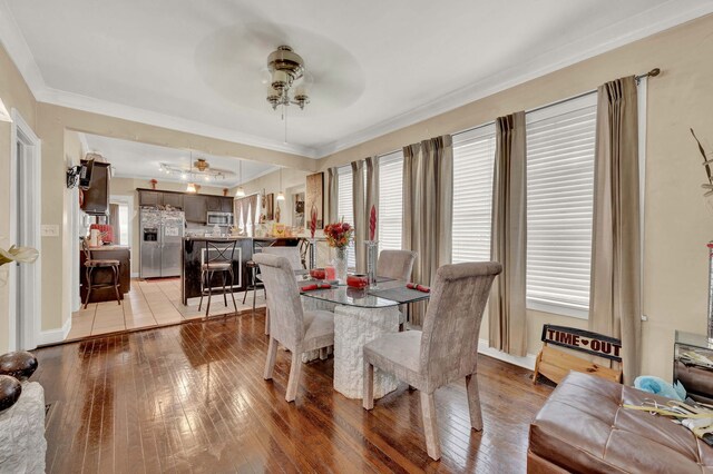 7800 S Aberdeen St, Chicago, IL 60620 - dining area featuring ceiling fan, light wood-style floors, crown molding, and baseboards