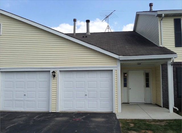 garage featuring driveway