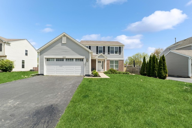 10616 Rushmore Ln, Huntley, IL 60142 - view of front facade with asphalt driveway, a garage, and brick siding