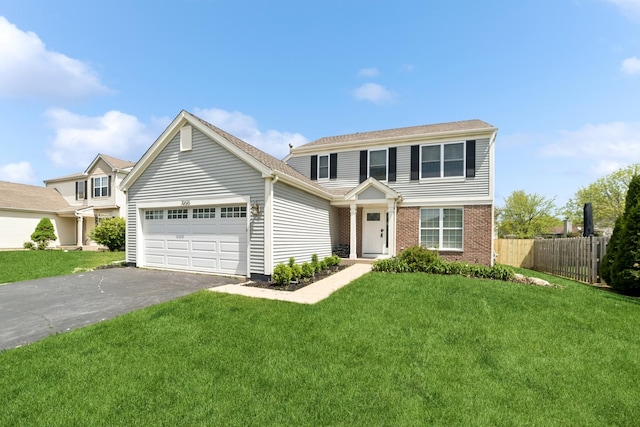 10616 Rushmore Ln, Huntley, IL 60142 - view of front of house with an attached garage, asphalt driveway, and brick siding