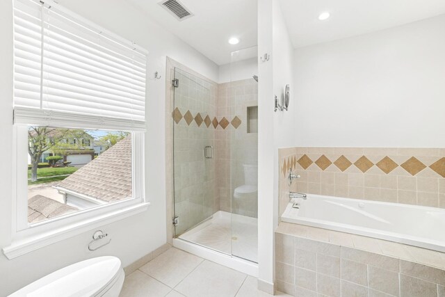 10616 Rushmore Ln, Huntley, IL 60142 - full bath featuring tile patterned floors, a stall shower, toilet, a bath, and recessed lighting