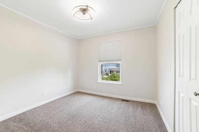 10616 Rushmore Ln, Huntley, IL 60142 - carpeted empty room featuring baseboards and ornamental molding