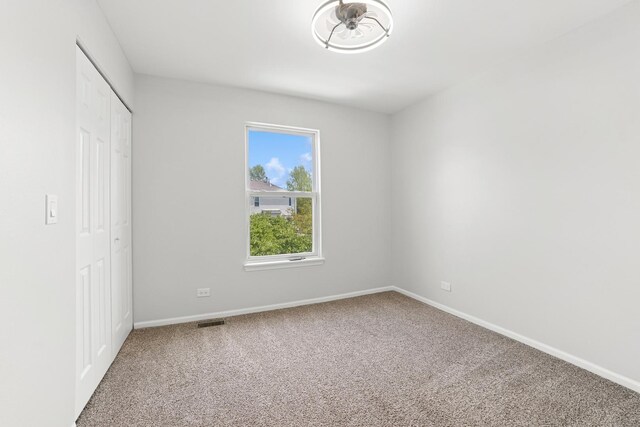 10616 Rushmore Ln, Huntley, IL 60142 - unfurnished bedroom with carpet, baseboards, and a closet