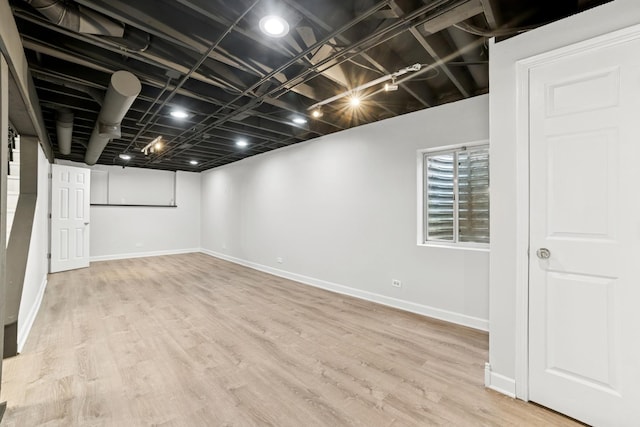 10616 Rushmore Ln, Huntley, IL 60142 - below grade area featuring wood finished floors and baseboards