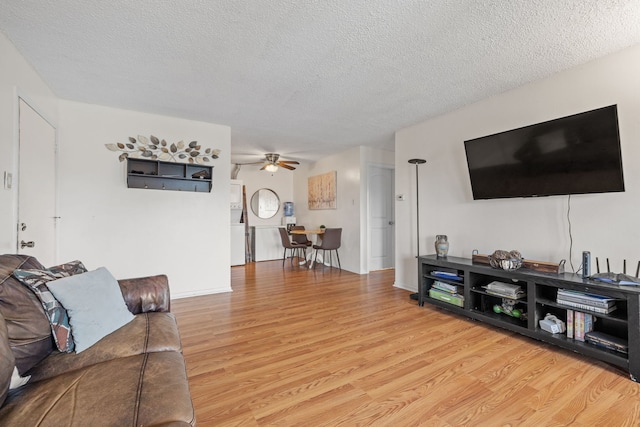 9935 El Cameno Real Dr Unit 3D, Orland Park, IL 60462 - living room featuring ceiling fan, a textured ceiling, and wood finished floors