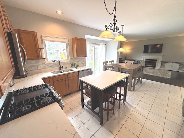1932 Royal Ln, Aurora, IL 60503 - kitchen featuring a sink, brown cabinetry, light tile patterned floors, backsplash, and light stone countertops