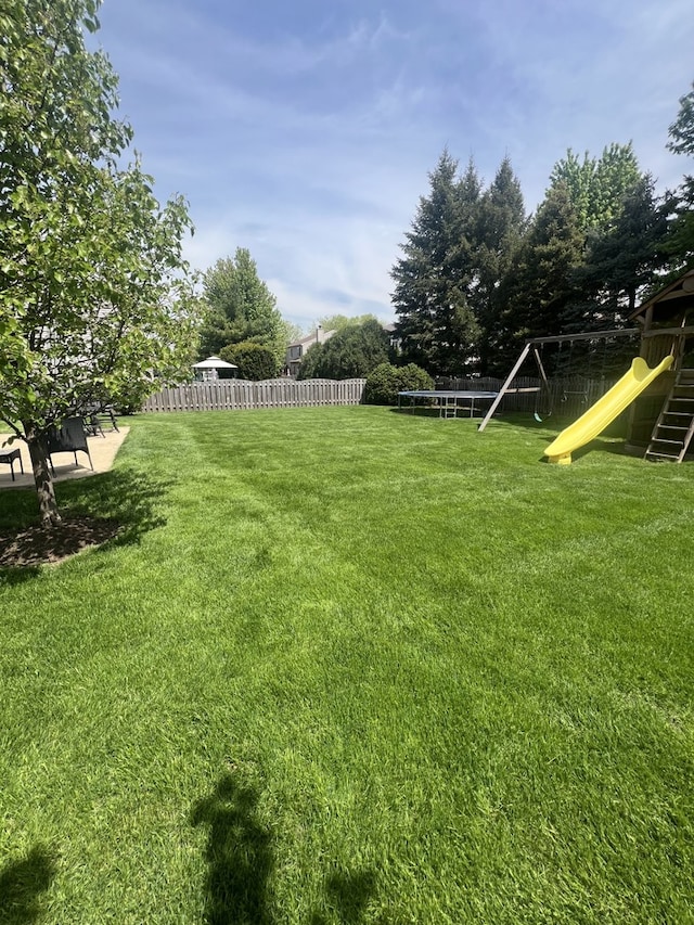 1932 Royal Ln, Aurora, IL 60503 - view of yard with a playground and a trampoline