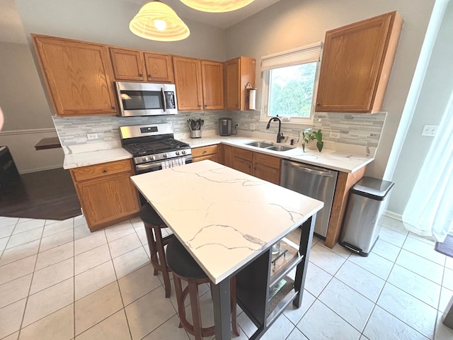 1932 Royal Ln, Aurora, IL 60503 - kitchen with appliances with stainless steel finishes, a sink, backsplash, and light tile patterned flooring