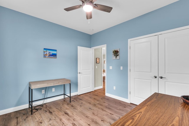 1608 E Horizon Ln, Urbana, IL 61802 - home office featuring baseboards, a ceiling fan, and wood finished floors