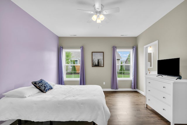 1608 E Horizon Ln, Urbana, IL 61802 - bedroom featuring dark wood-style flooring, baseboards, and a ceiling fan