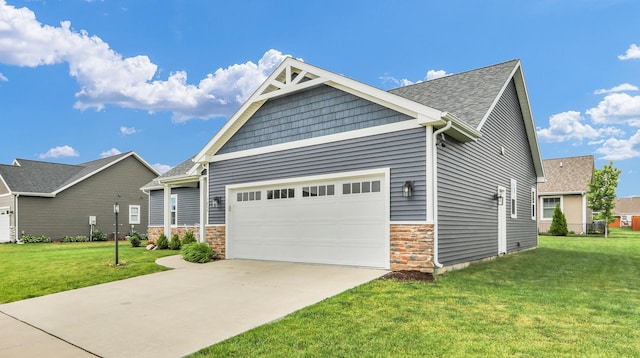 1608 E Horizon Ln, Urbana, IL 61802 - craftsman-style home with a garage, stone siding, a front lawn, and concrete driveway