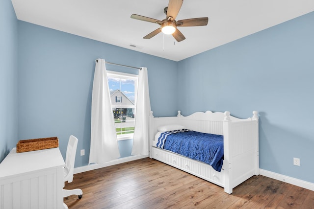 1608 E Horizon Ln, Urbana, IL 61802 - bedroom featuring wood-type flooring, baseboards, and a ceiling fan