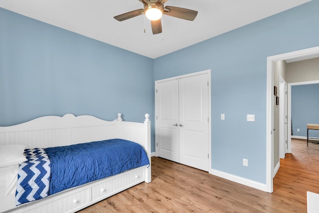 1608 E Horizon Ln, Urbana, IL 61802 - bedroom with wood finished floors, baseboards, a closet, and a ceiling fan
