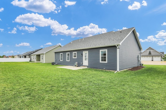 1608 E Horizon Ln, Urbana, IL 61802 - back of house with a patio area, central AC unit, and a shingled roof