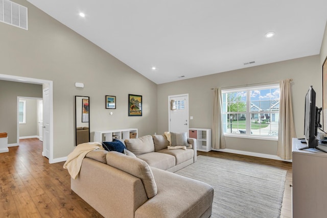 1608 E Horizon Ln, Urbana, IL 61802 - living area with wood finished floors, baseboards, high vaulted ceiling, and recessed lighting
