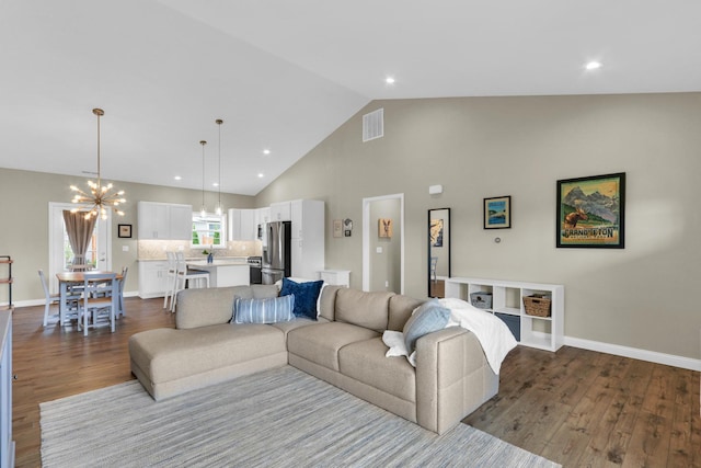 1608 E Horizon Ln, Urbana, IL 61802 - living room with a chandelier, dark wood-style flooring, high vaulted ceiling, baseboards, and recessed lighting