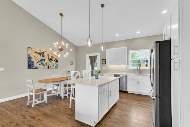 1608 E Horizon Ln, Urbana, IL 61802 - kitchen featuring stainless steel appliances, dark wood-style flooring, a sink, white cabinets, and light countertops