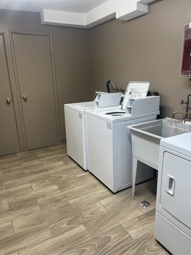 19380 Wolf Rd Unit 5, Mokena, IL 60448 - community laundry with washing machine and clothes dryer and light wood-style floors