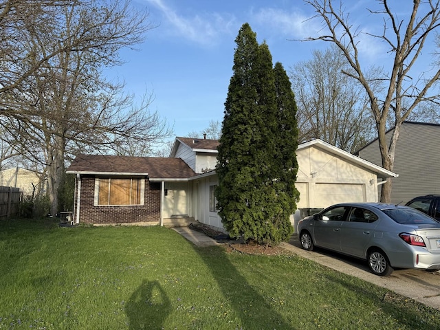view of front of house with brick siding, an attached garage, concrete driveway, a front lawn, and a shingled roof
