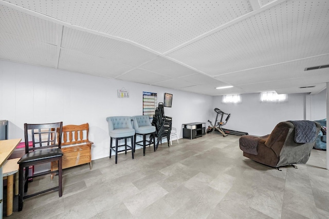 sitting room featuring a paneled ceiling