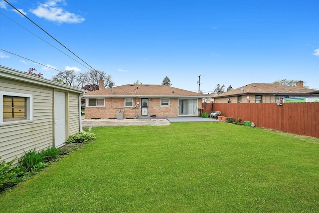 back of property with a patio