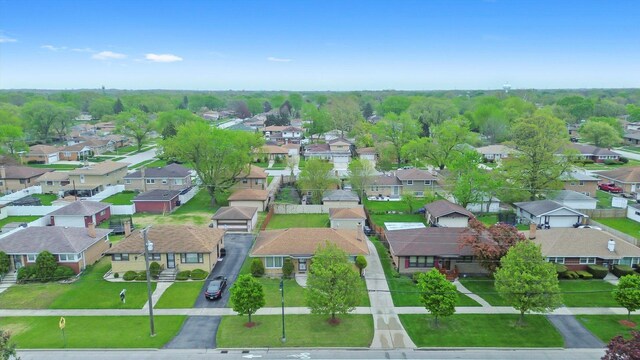 aerial view of property and surrounding area with nearby suburban area