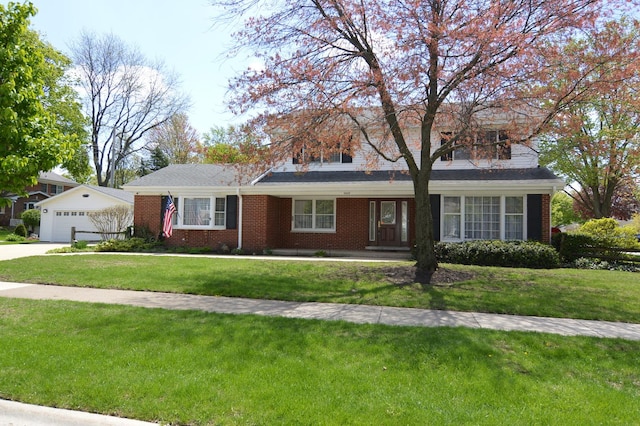2405 E Miner St, Arlington Heights, IL 60004 - ranch-style home featuring a front yard, brick siding, and a garage