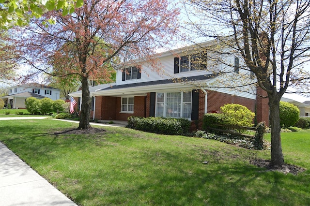 2405 E Miner St, Arlington Heights, IL 60004 - traditional-style home with a front lawn and brick siding