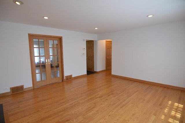 2405 E Miner St, Arlington Heights, IL 60004 - spare room with french doors, light wood finished floors, recessed lighting, and baseboards