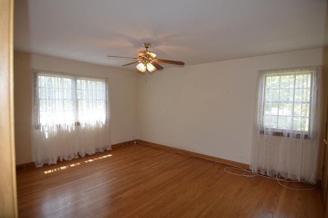 2405 E Miner St, Arlington Heights, IL 60004 - spare room featuring a ceiling fan, light wood-style flooring, plenty of natural light, and baseboards