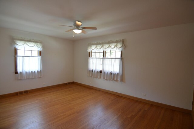 2405 E Miner St, Arlington Heights, IL 60004 - unfurnished room featuring ceiling fan, light wood-style flooring, and baseboards