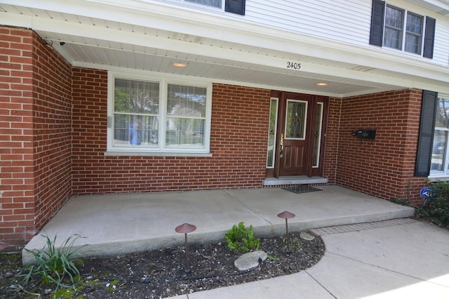2405 E Miner St, Arlington Heights, IL 60004 - view of exterior entry featuring brick siding and covered porch
