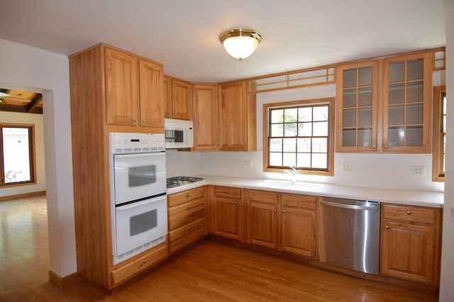 2405 E Miner St, Arlington Heights, IL 60004 - kitchen with stainless steel appliances, a sink, light wood-style floors, and light countertops