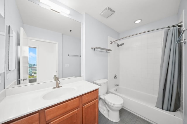 full bath featuring toilet, vanity, shower / bath combo, and tile patterned flooring