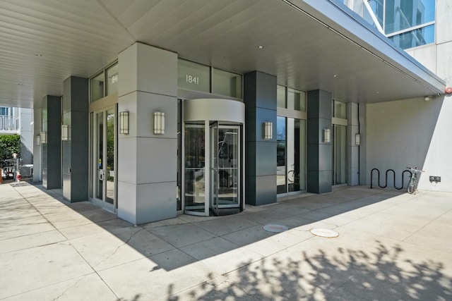 view of exterior entry with stucco siding