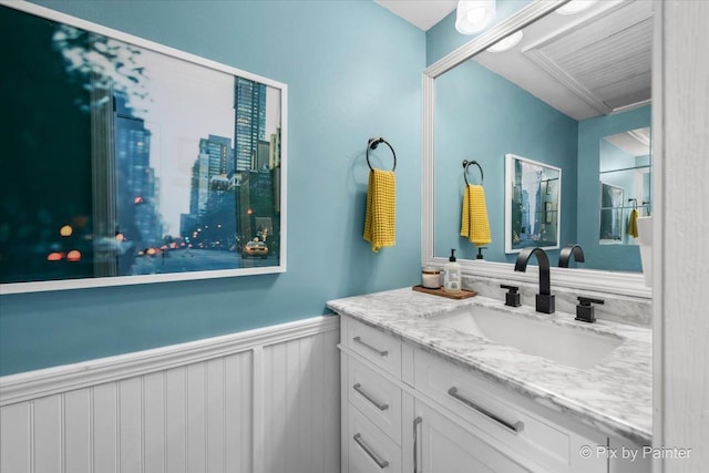 bathroom featuring wainscoting and vanity