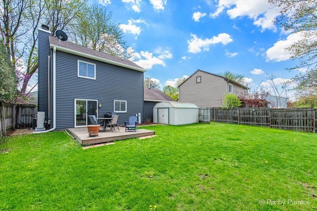 rear view of house featuring a wooden deck, a shed, a chimney, an outdoor structure, and central AC unit
