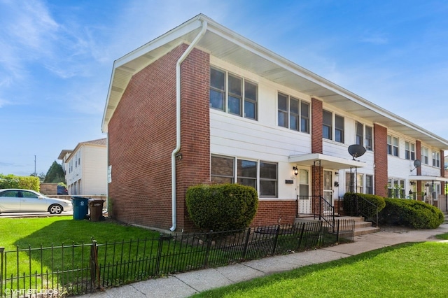 563 Lynn Ct Unit A, Glendale Heights, IL 60139 - townhome / multi-family property featuring brick siding