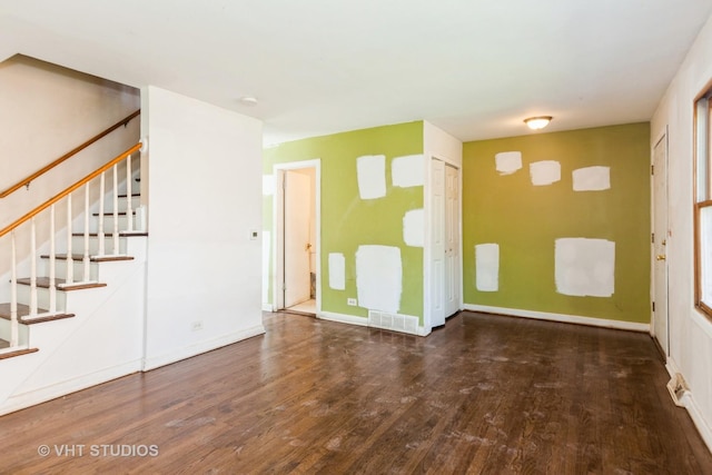 563 Lynn Ct Unit A, Glendale Heights, IL 60139 - unfurnished living room featuring wood finished floors, stairway, and baseboards
