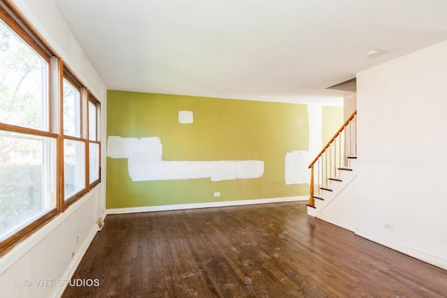 563 Lynn Ct Unit A, Glendale Heights, IL 60139 - spare room featuring wood finished floors, stairway, healthy amount of natural light, and baseboards