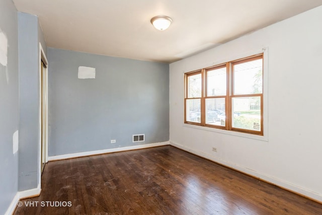563 Lynn Ct Unit A, Glendale Heights, IL 60139 - spare room with wood finished floors and baseboards