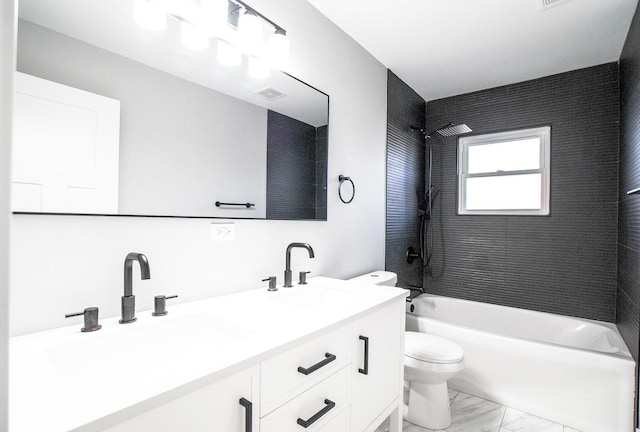 full bath with toilet, marble look tiles, bathtub / shower combination, and double vanity