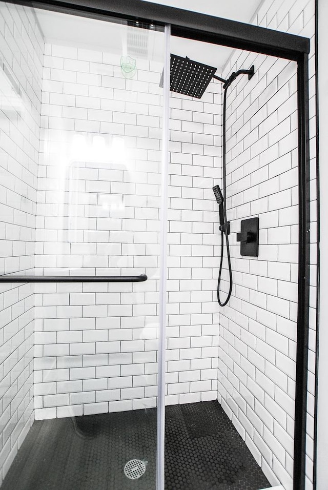 bathroom with a shower stall