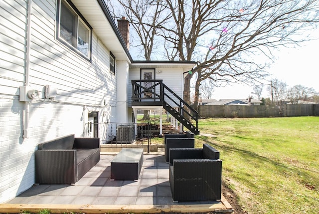 view of patio / terrace with an outdoor living space, stairway, and central AC unit