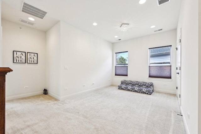 carpeted spare room featuring recessed lighting and baseboards